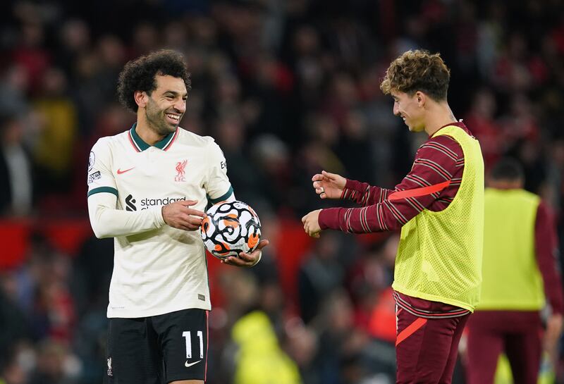 Liverpool hat-trick scorer Mohamed Salah celebrates with the match ball after the final whistle. AP