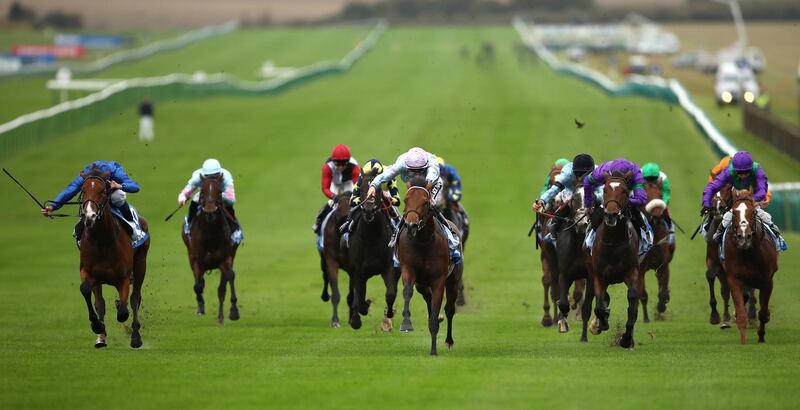 Tomfre, ridden by Harry Bentley (centre), clinched The Dubai Nursery at Newmarket. Press Association
