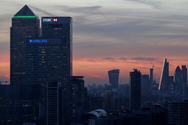 FILE PHOTO: Canary Wharf and the city are seen at sunset in London, December 14, 2016. REUTERS/Eddie Keogh/File Photo