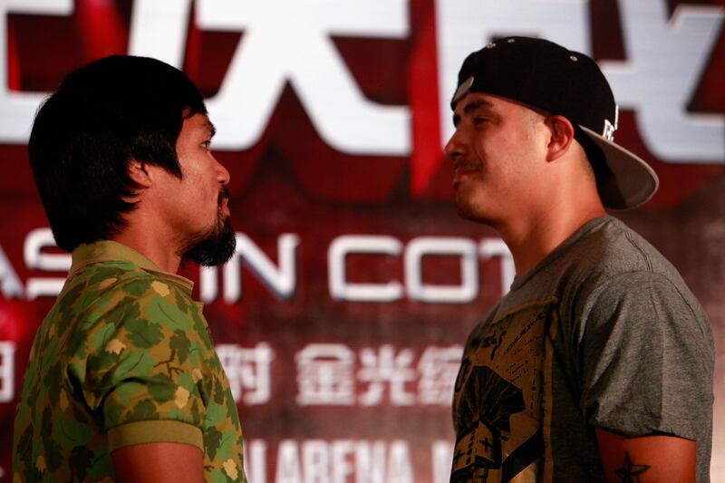 SHANGHAI, CHINA - JULY 31:  Manny Pacquiao (L) and Brandon Rios (R) square off during a press conference on July 31, 2013 in Shanghai, China.  (Photo by Kevin Lee/Getty Images) *** Local Caption ***  175071985.jpg