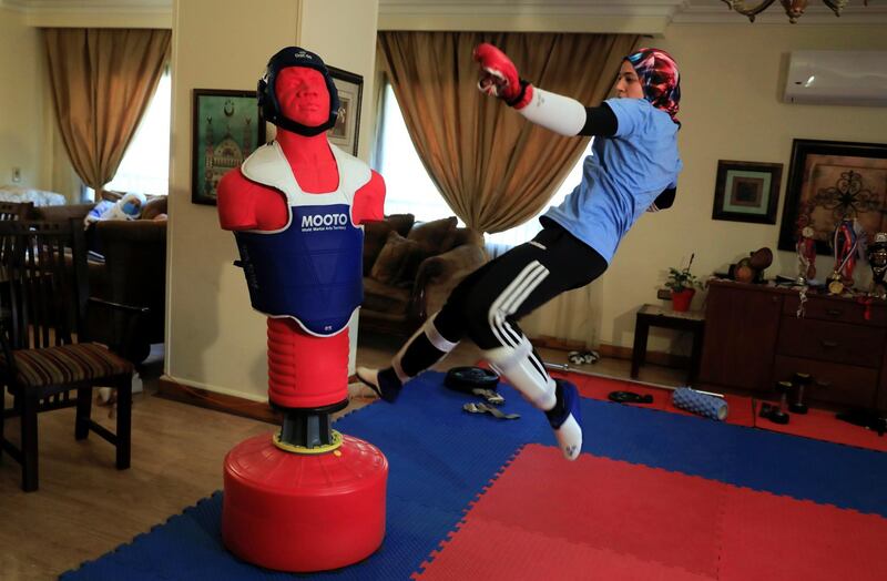 Hedaya Malak Wahba, Egyptian Taekwondo practitioner and 2016 Rio Olympics bronze medallist, works out at her home as she trains for the postponed Tokyo Olympic Games, in Cairo, Egypt. Reuters
