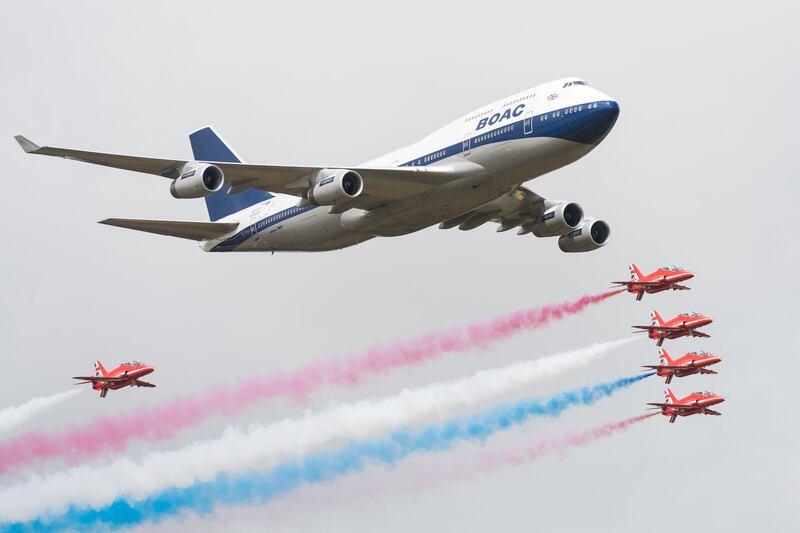 FAIRFORD, ENGLAND - JULY 20:  A British Airways special liveried Boeing 747 takes to the skies alongside the Red Arrows during the 2019 Royal International Air Tattoo on July 20, 2019 at RAF Fairford, England. The Boeing 747 has been painted in the airline's predecessor British Overseas Airways Corporation (BOAC) livery to mark British Airways' centenary this year.  (Photo by Ian Gavan/Getty Images for British Airways) 