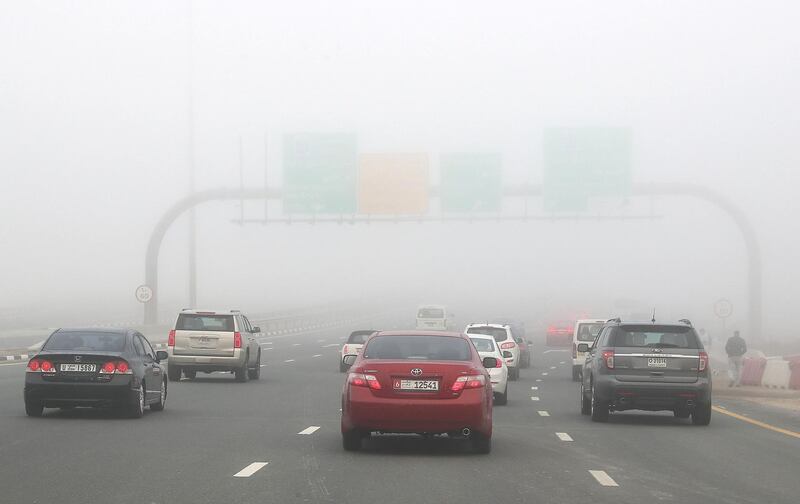 DUBAI , UNITED ARAB EMIRATES , JAN 15 – 2018 :- Traffic during the early morning fog in Dubai.  (Pawan Singh / The National) For News