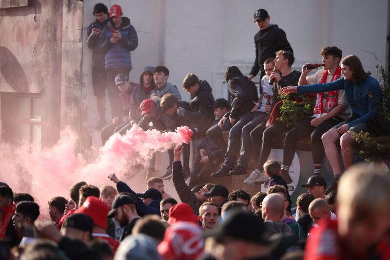 Liverpool fans with flares outside the stadium. Reuters