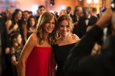 Jennifer Aniston, left, and Reese Witherspoon in a scene from 'The Morning Show'. AP.