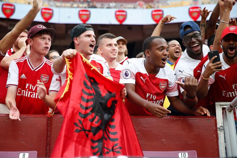 Arsenal fans cheer from the stands at FedEx Field. Reuters