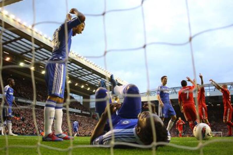 LIVERPOOL, ENGLAND - MAY 08:  Ryan Bertrand () of Chelsea shows his frustration as Daniel Agger of Liverpool celebrates scoring their third goal with Luis Suarez and Martin Skrtel of Liverpool during the Barclays Premier League match between Liverpool and Chelsea at Anfield on May 8, 2012 in Liverpool, England.  (Photo by Alex Livesey/Getty Images)