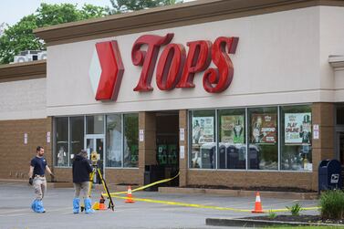 Members of the FBI search for evidence at the scene of a shooting at a Tops supermarket in Buffalo, New York, U. S.  May 16, 2022.  REUTERS / Brendan McDermid