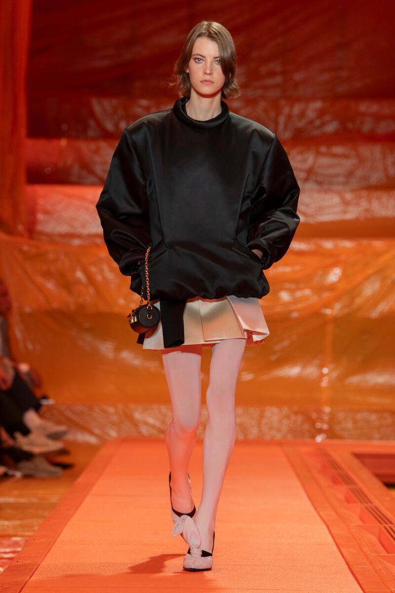A rounded jacket is paired with a mini skirt at Louis Vuitton. Photo: Louis Vuitton