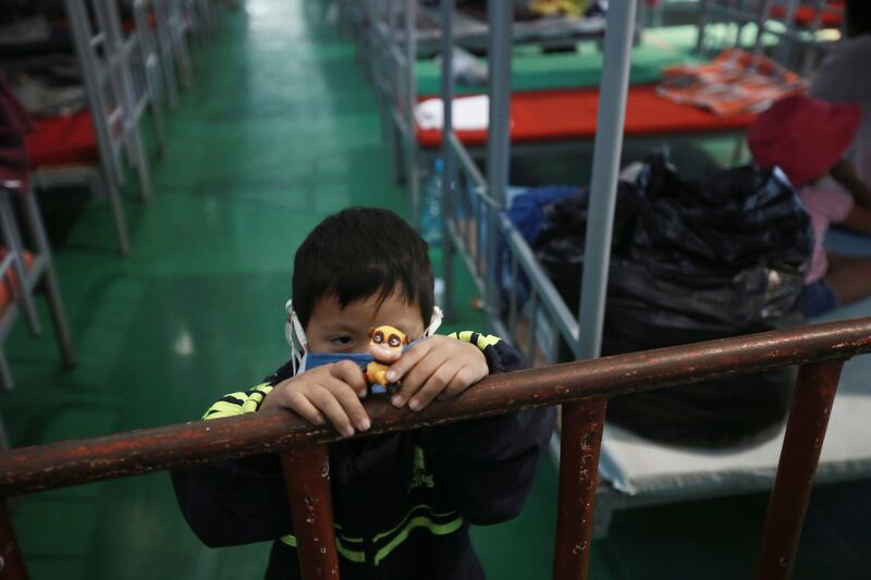 A child plays in the Kiki Romero Sports Complex after he was deported from the US, in Ciudad Juarez, Mexico, April 21. Mexico said it is planning to set up 17 shelters for underage migrants along the country's southern border, as well as some along the northern border with the US, amid a wave of child migrants coming from Central America. AP