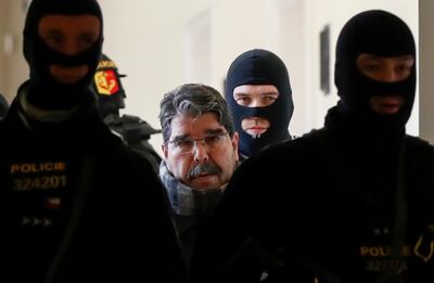 Syrian Kurdish leader Saleh Muslim (C) is escorted by Czech police for his trial at the municipal court on February 27, 2018 in Prague.
A Czech court released Muslim, who was detained at the weekend and is wanted by Turkey on terror charges, his lawyer said. The former leader of the Syrian Kurdish Democratic Union Party (PYD) is still a figurehead for Kurds in Syria. / AFP PHOTO / Stringer / ALTERNATIVE CROP 