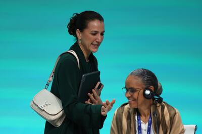 UAE's Minister of Climate Change and Environment Mariam Al Mheiri leaves next to Brazil's Minister of the Environment and Climate Change Marina Silva after attending a press conference during Cop28. EPA