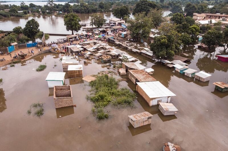 This aerial photograph shows the quarters totally flooded by the water, in Bangui, on October 28, 2019. - Decadal floods are commonplace on the Oubangui River, but it has been the highest in 20 years, according to the head of the Central African Red Cross, which has left 28,000 people homeless due to rising water levels. (Photo by FLORENT VERGNES / AFP)