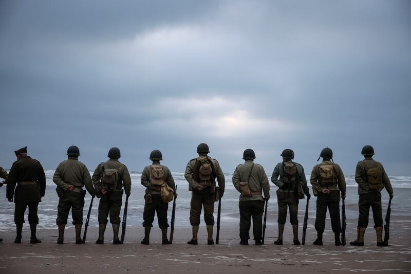 People gather on Omaha Beach in Normandy, France, to re-enact the D-Day invasion of June 6, 1944, that helped to change the course of the Second World War.  AP