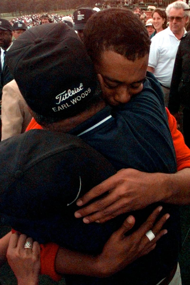 Tiger Woods hugs his his father, Earl, after winning the 1997 Masters. AP Photo