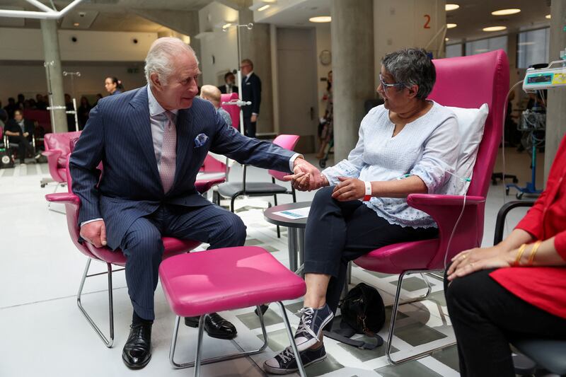 King Charles III, patron of Cancer Research UK and Macmillan Cancer Support, meets patient Asha Millan at University College Hospital Macmillan Cancer Centre, London. PA