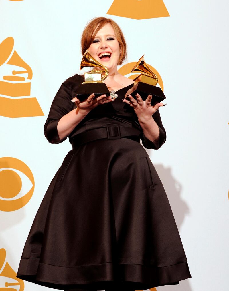 epa01629298 British recording artist Adele holds her two Grammy Awards for Best New Artist and Best Female Pop Vocal Performance for 'Chasing Pavements' at the 51th Annual Grammy Awards at the Staples Center in Los Angeles, California, USA, 08 February 2009.  EPA/ANDREW GOMBERT