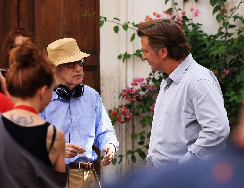 Director Woody Allen and Alec Baldwin speak during the filming of 'To Rome With Love' (2012) at Piazza Madonna Dei Monti. Getty