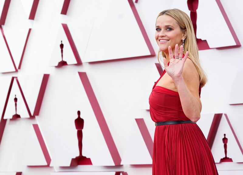Reese Witherspoon arrives to the Oscars red carpet for the 93rd Academy Awards in Los Angeles, California, US, April 25, 2021. Reuters