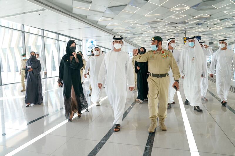 Sheikh Mansoor speaks with an officer at the Expo 2020 Dubai site while reviewing safety and security preparations. Photo: Dubai Media Office