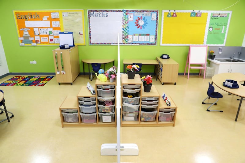 DUBAI, UNITED ARAB EMIRATES , August 9 – 2020 :- View of the partition in the center as a Covid 19 safety measure inside the year 1 class room at the Dubai British School in Jumeirah Park in Dubai. New Covid safety setup in different areas of the school such as hand sanitizer , safety message, social distancing stickers pasted on the floor, thermal cameras will be installed at the entrance of the school. School will open on 30th August. (Pawan Singh / The National) For News/Online/Instagram. Story by Kelly