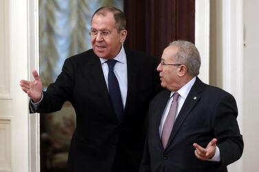 Russian Foreign Minister Sergei Lavrov and Algerian Deputy Prime Minister and Foreign Minister Ramtane Lamamra enter a hall during their meeting in Moscow. EPA