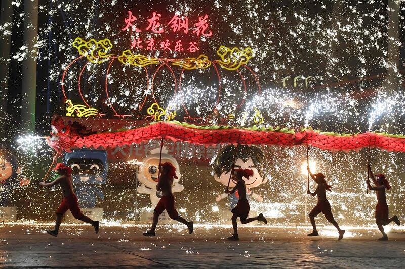 Dragon dancers perform at a park in Beijing on the fourth day of the Lunar New Year.  AFP