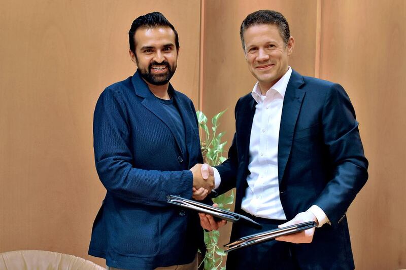 Badr Jafar, the chief executive of Crescent Enterprises, right, and Ashish Thakkar, the founder of Mara Group.