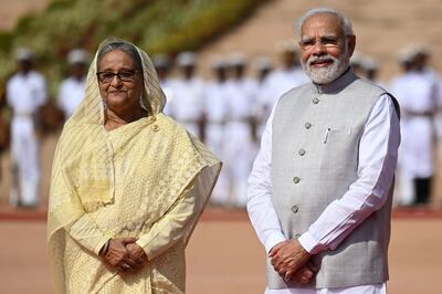 Bangladesh's Prime Minister Sheikh Hasina, left, and her Indian counterpart Narendra Modi during her ceremonial reception at India's presidential palace Rashtrapati Bhavan in New Delhi on Tuesday. AFP