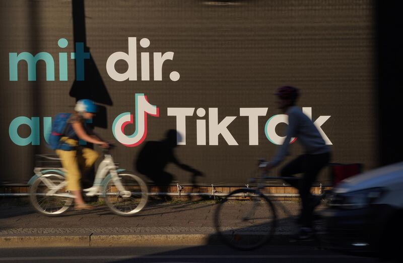 BERLIN, GERMANY - SEPTEMBER 21:  Bicyclists ride past an advertisement for social media company TikTok on September 21, 2020 in Berlin, Germany. U.S. President Donald Trump has given preliminary approval for Oracle, Walmart and other investors to take over TikTok and create a new U.S.-based company called TikTok Global. (Photo by Sean Gallup/Getty Images)