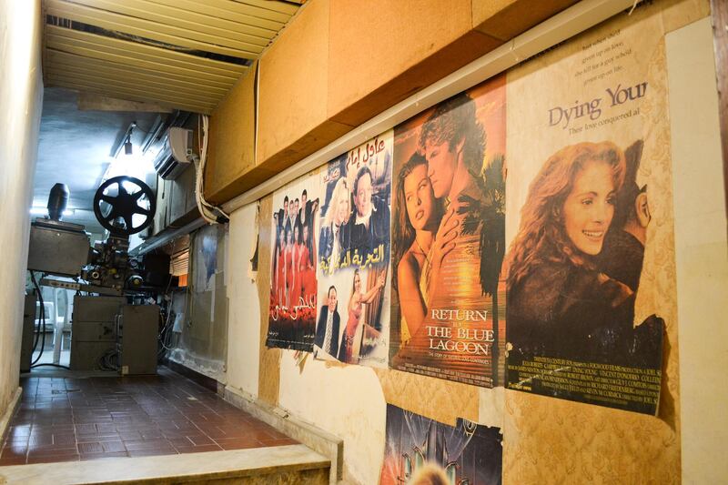 Posters of old films are still up on the walls of the projection booth. India Stoughton