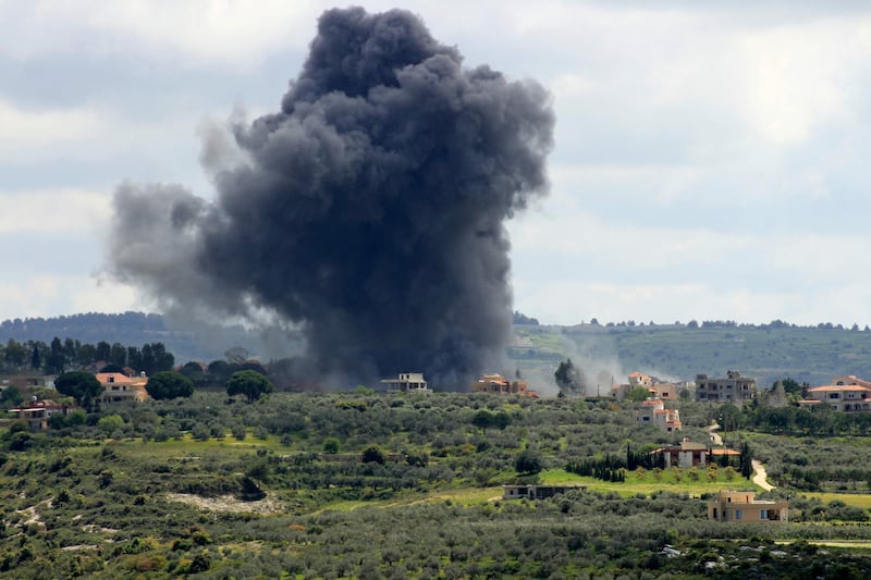 Smoke billows after an Israeli strike on the southern Lebanese border village of Tayr Harfa on April 6. AFP