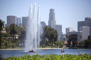 People ride paddle boats on a hot day at Echo Park Lake in Los Angeles, California. REUTERS/Mario Anzuoni