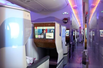 An in-flight entertainment screen sits on seating in the business class cabin of an Airbus SE A380-800 passenger aircraft, operated by Emirates Airlines, during the 15th Dubai Air Show at Dubai World Central (DWC) in Dubai, United Arab Emirates, on Monday, Nov. 13, 2017. The biennial Dubai expo is an important venue for manufacturers to secure deals for their biggest and most expensive jetliners. Photographer: Natalie Naccache/Bloomberg