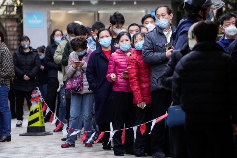 People line up at a nucleic acid testing site outside a hospital during a mass testing for the coronavirus disease (COVID-19), following the outbreak in Shanghai. Reuters