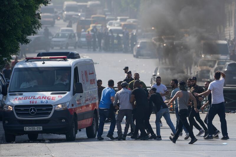 Palestinian health officials said three people were killed and at least 40 people wounded in the gun battle.  AP Photo