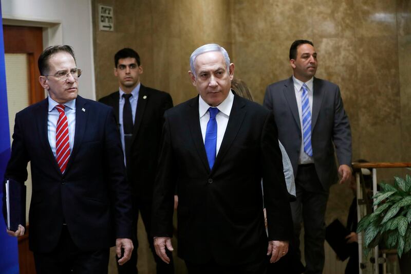 Israeli Prime Minister Benjamin Netanyahu arrives to the weekly cabinet meeting in Jerusalem on Sunday, Dec. 8, 2019. (Ronen Zvulun/ Pool photo via AP)