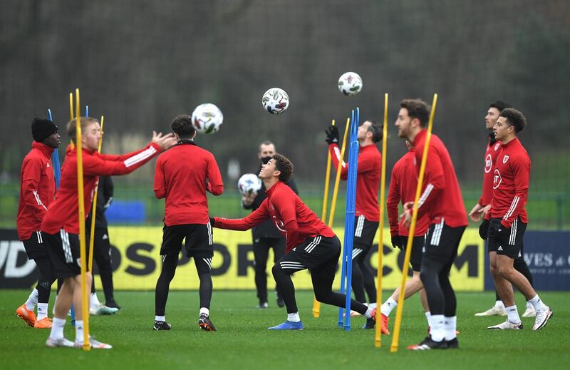 The Welsh squad take part in a warm up exercise during training. Getty