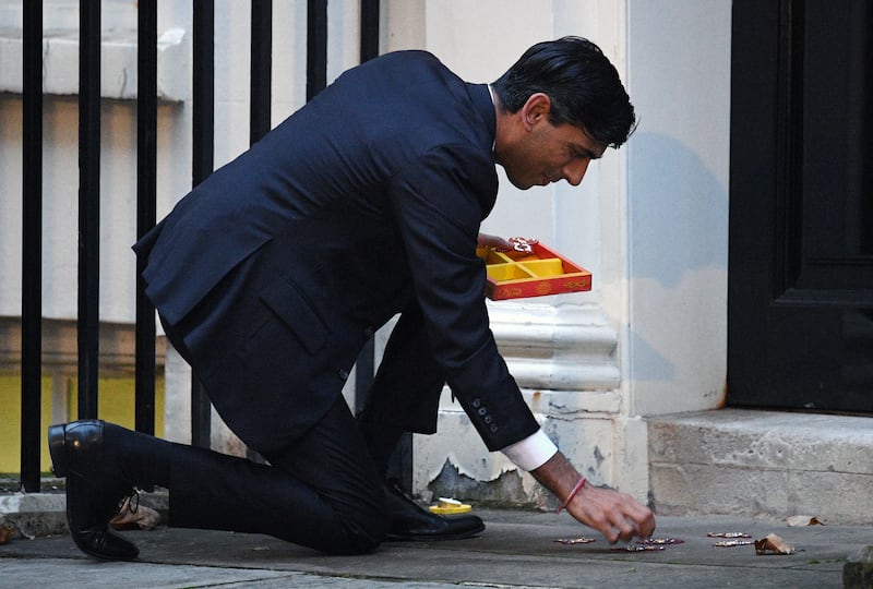 Lighting a candle for Diwali on Downing Street, November 2020. Getty Images