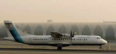 A French-made ATR-72 owned by Iran's Aseman Airlines sits on the tarmac at Dubai airport on July 29, 2008. AFP PHOTO/MARWAN NAAMANI / AFP PHOTO / MARWAN NAAMANI