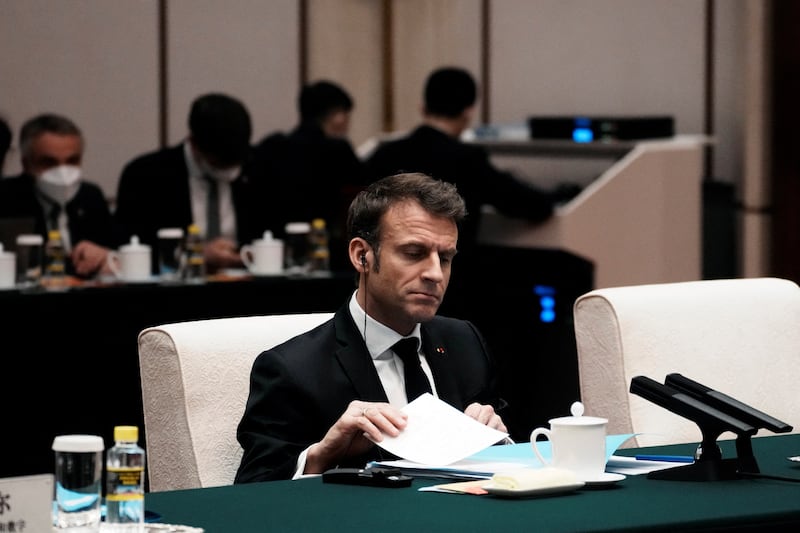 Mr Macron during a meeting at the Great Hall of the People. Reuters