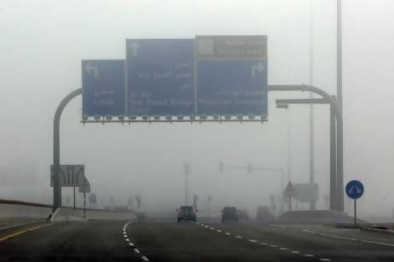 Heavy fog caused disruption on the roads and at Abu Dhabi airport on Monday. Ravindranath K / The National
