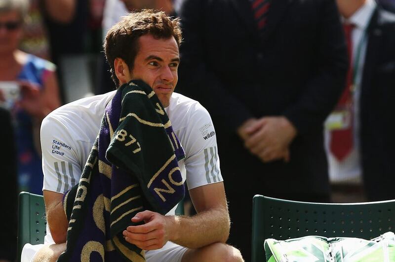 Andy Murray reacts during his loss to Grigor Dimitrov in the 2014 Wimbledon Championships on Wednesday at the All England Club. Matthew Stockman / Getty Images