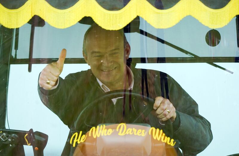 Liberal Democrats leader Ed Davey drives a tractor during a visit to Owl Lodge in Lacock, Wiltshire. PA