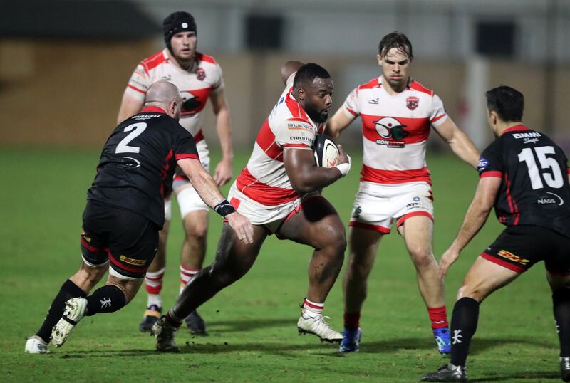 Tigers' Deanne Makoni tries to break the Bahrain defence. 