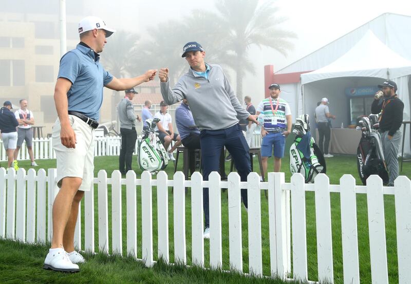 Justin Thomas of the US fist bumps compatriot John Catlin on the driving range. Getty Images