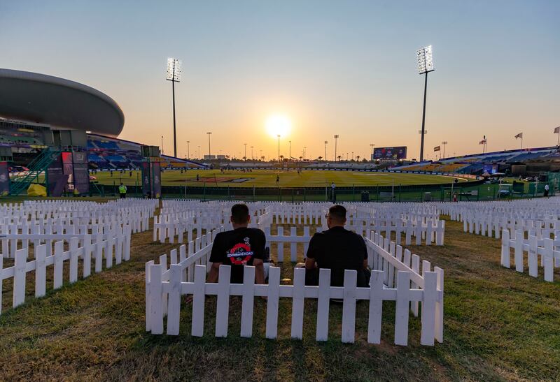 Fans at the Zayed Cricket Stadium in special family 'pods' on the grass banks.