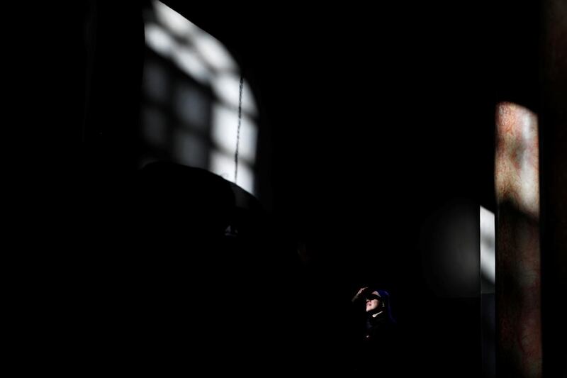 A nun looks on inside the Church of the Nativity in Bethlehem. Reuters