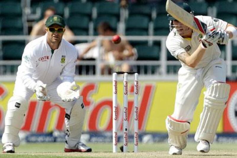 Australia's captain Michael Clarke, right, plays a shot as South Africa's wicketkeeper Mark Boucher looks on during the second day of the second test cricket match at the Wanderers stadium in Johannesburg, South Africa