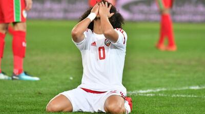 Omar Abdulrahman is dejected after missing his penalty in the Gulf Cup of Nations shoot-out against Oman in Kuwait City. Giuseppe Cacace / AFP